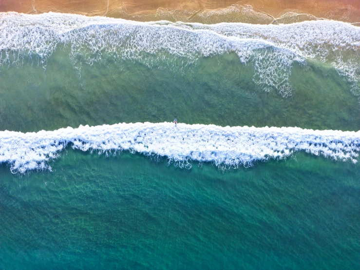 a view of some water, blue and white waves