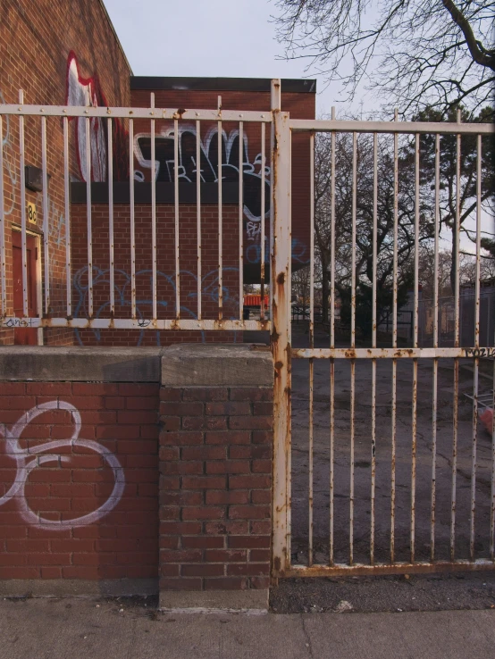 the gate is behind the large brick wall