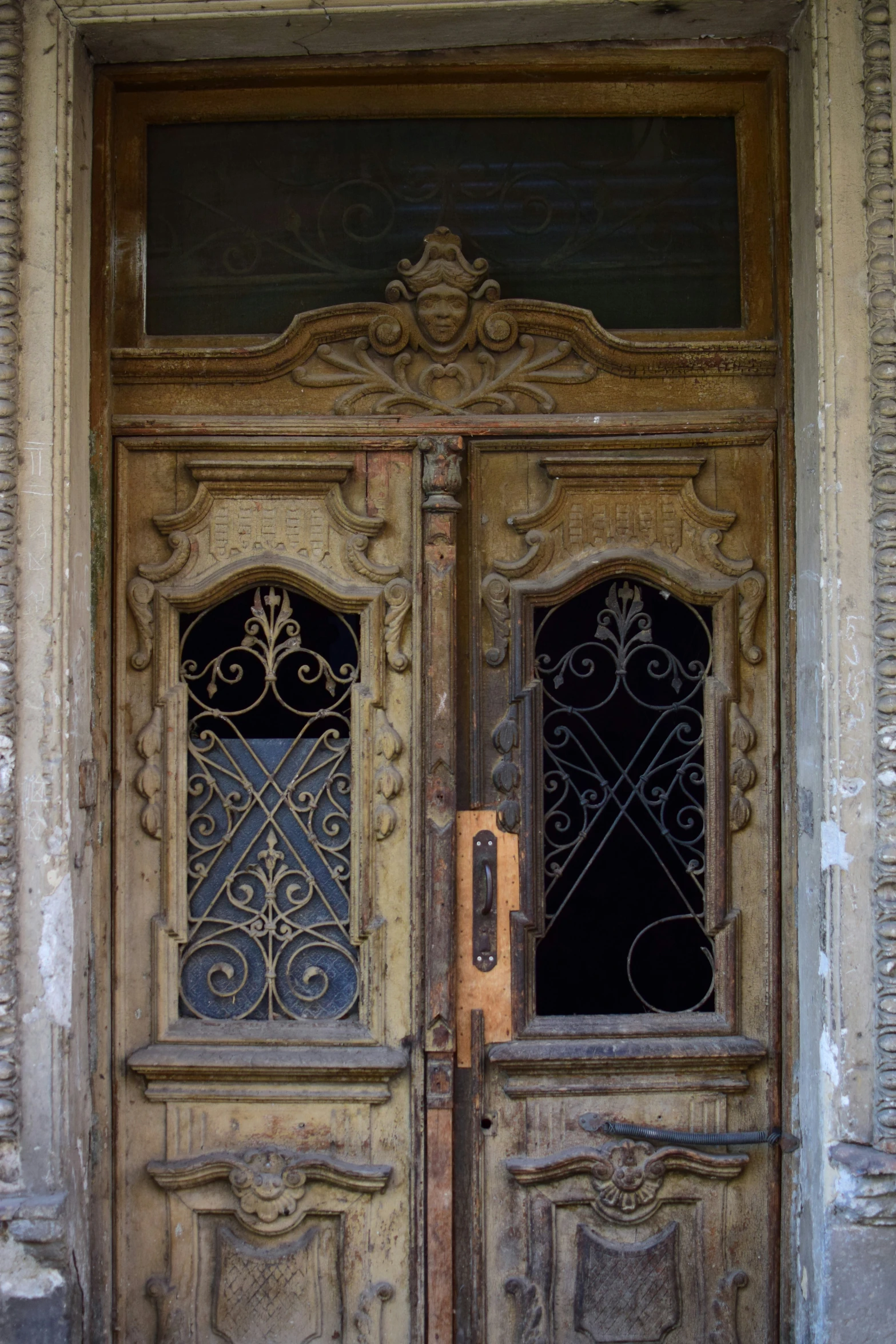 the old and worn door is open to the room