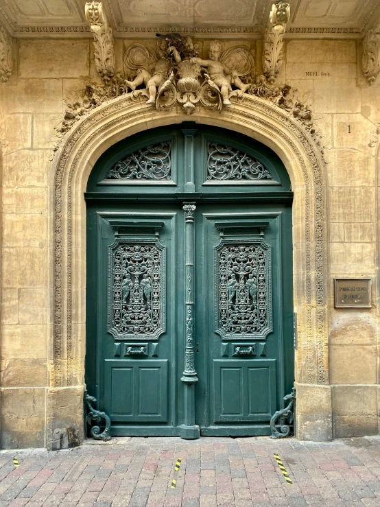 this po shows a green door and ornate design