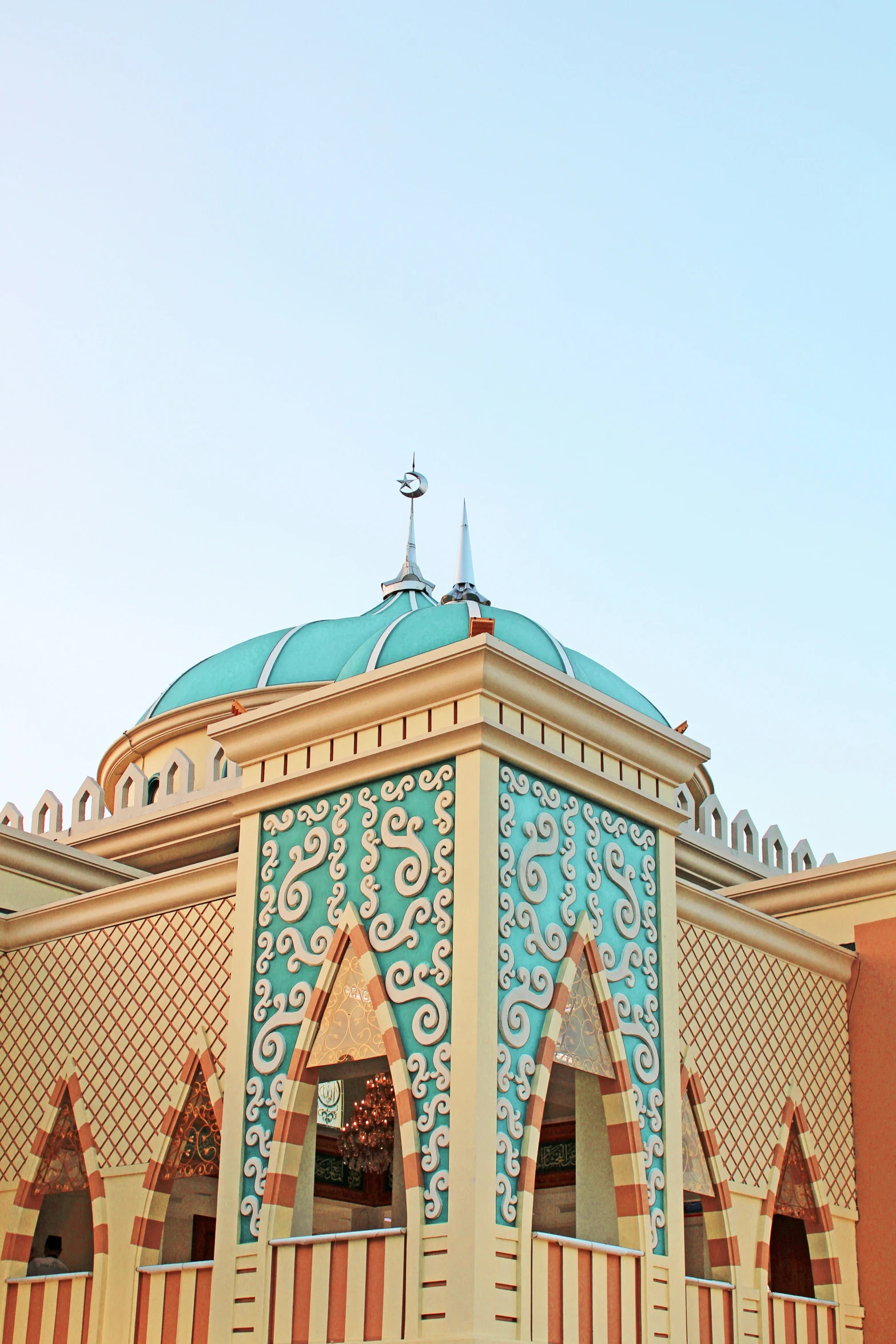 a clock on top of a building on a sunny day