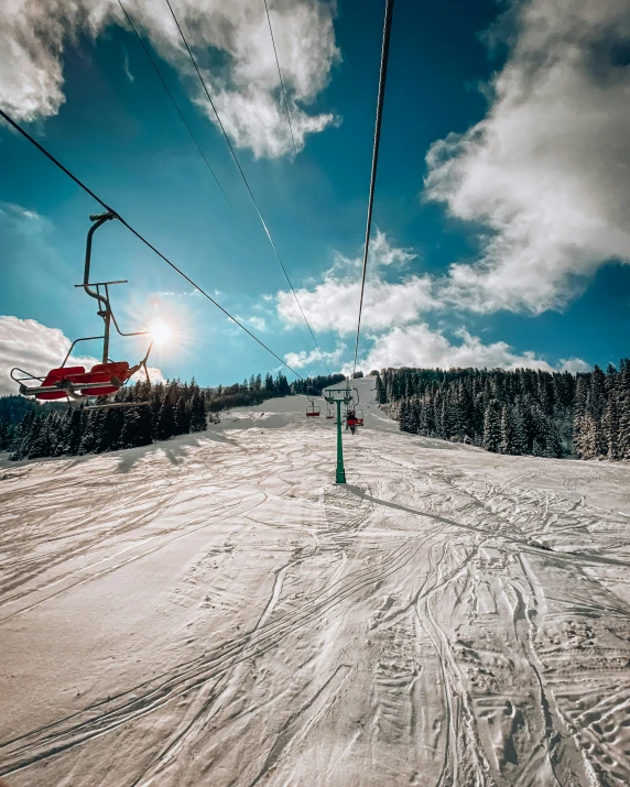 the skier is skiing under the wires above the snow