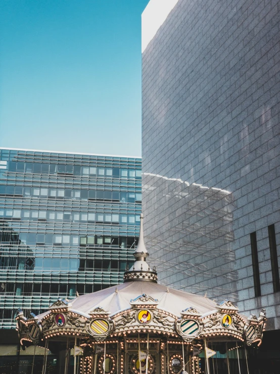 a merry go round outside near the city