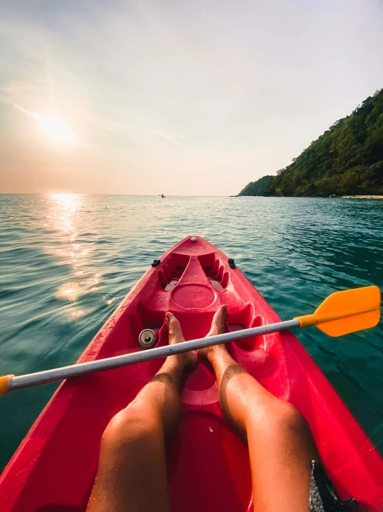 a kayak is moving along a very pretty bay