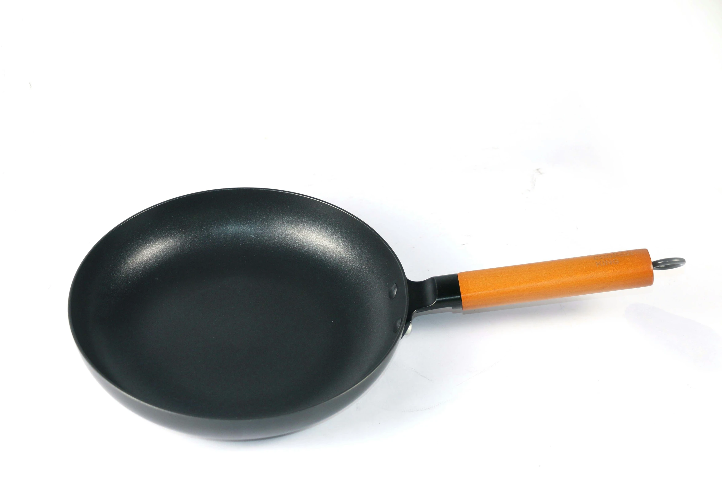 a black cast iron set with wooden handle