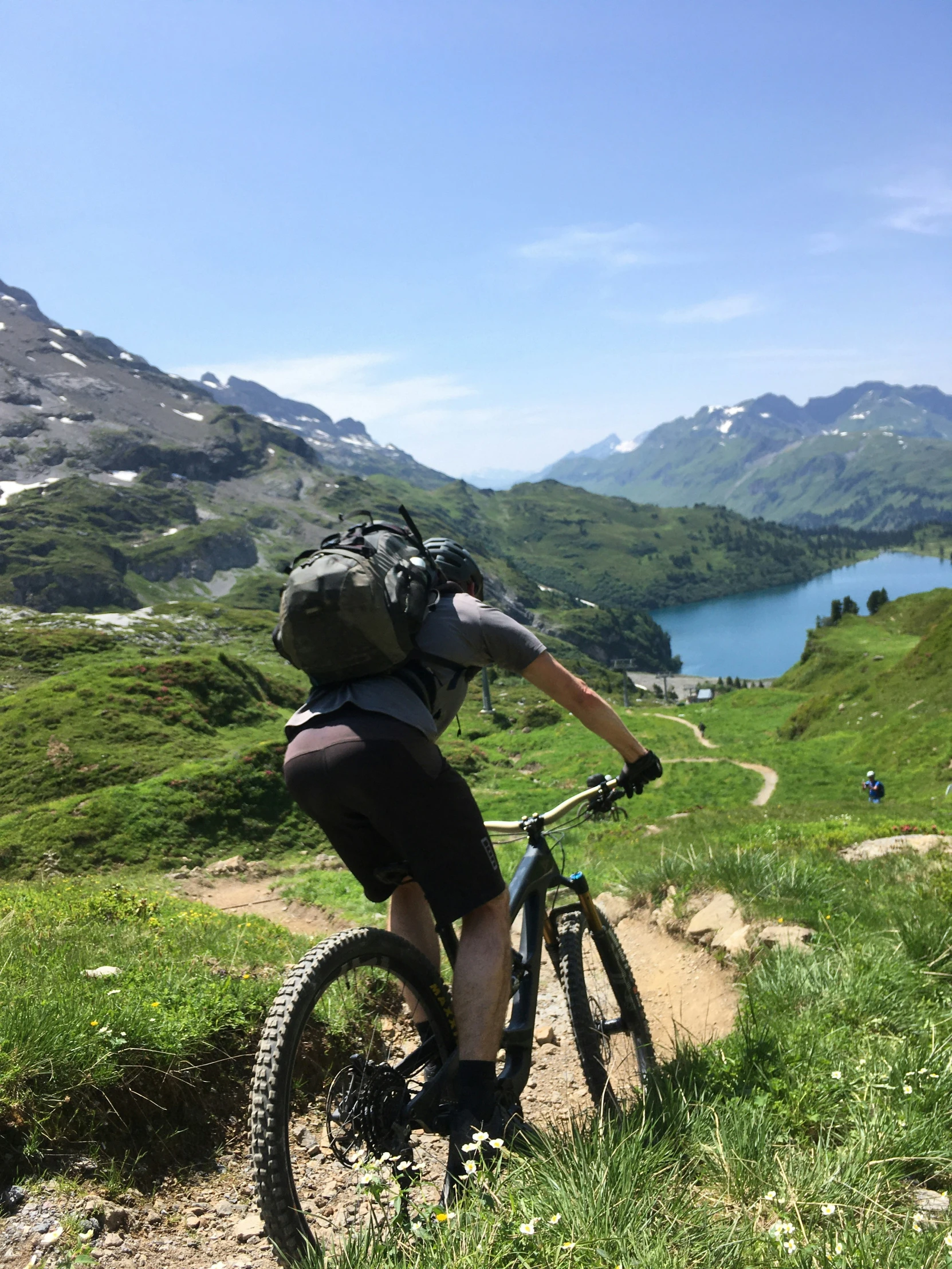 a man on a mountain bike up the side of a trail