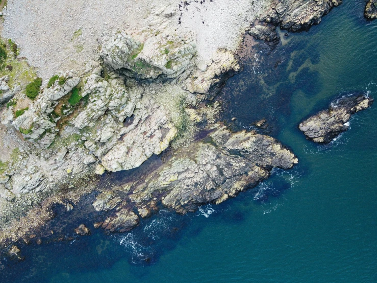 the view of a large body of water near a rocky area