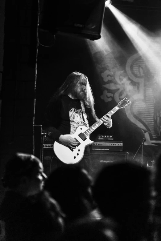 black and white pograph of guitarist in concert