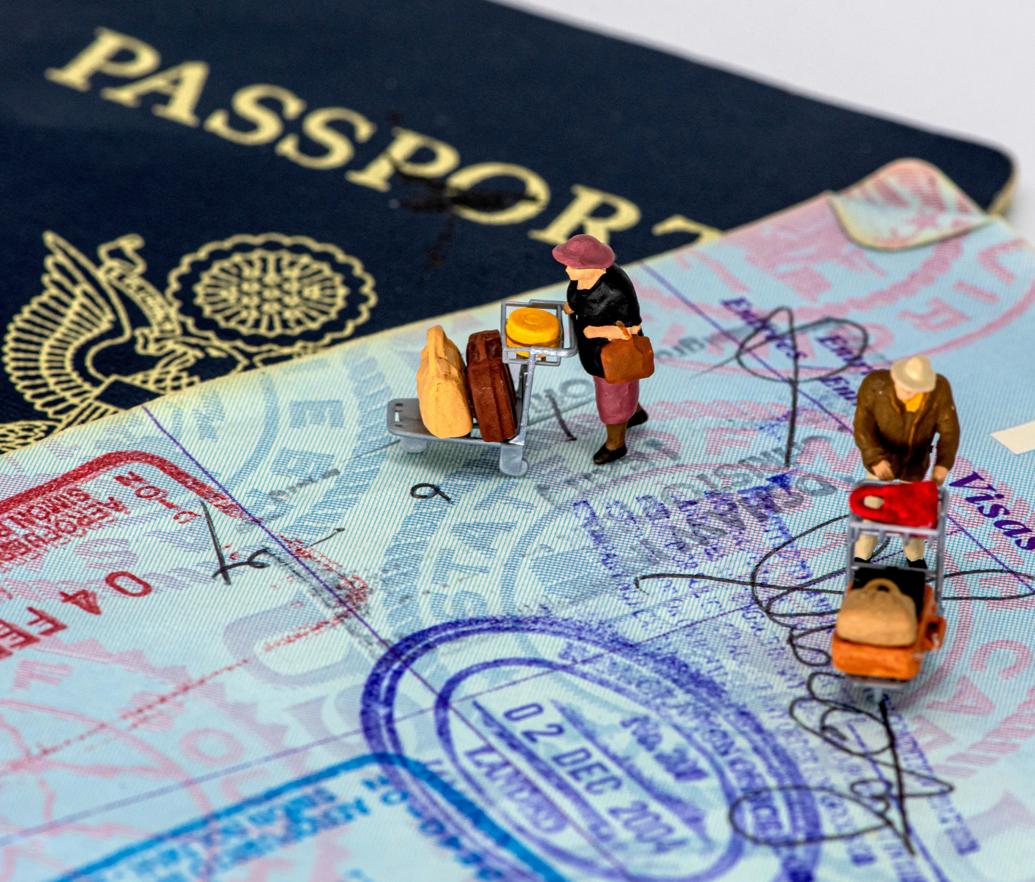 two toy people holding a passport