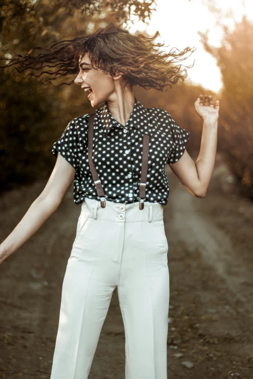 a woman with her hair in the air