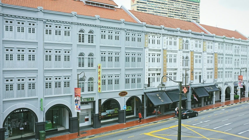 the large buildings are lined up on the street