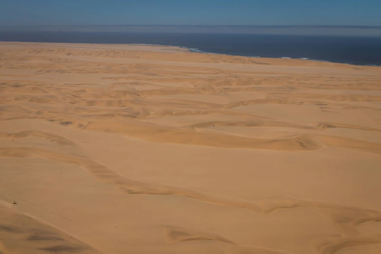 the beach sand is covering the ground with ridges