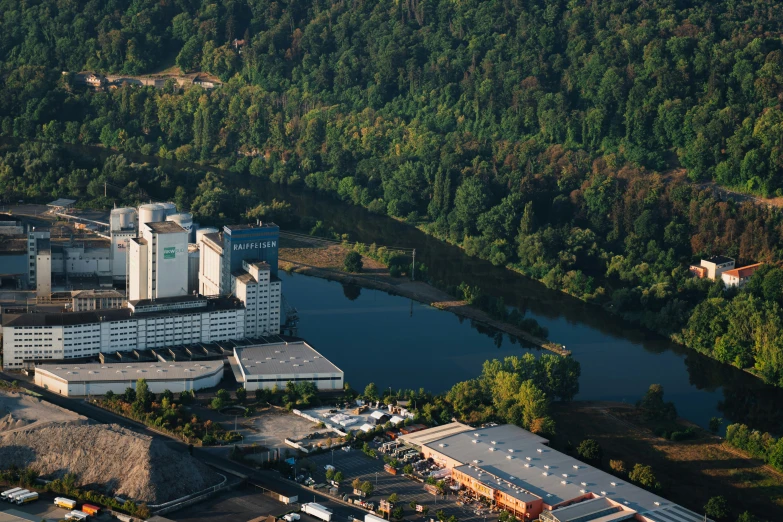 an aerial view of a factory and surrounding trees