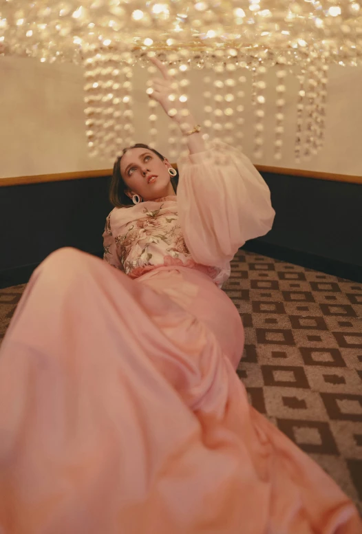 a woman laying on a rug in an elegant setting