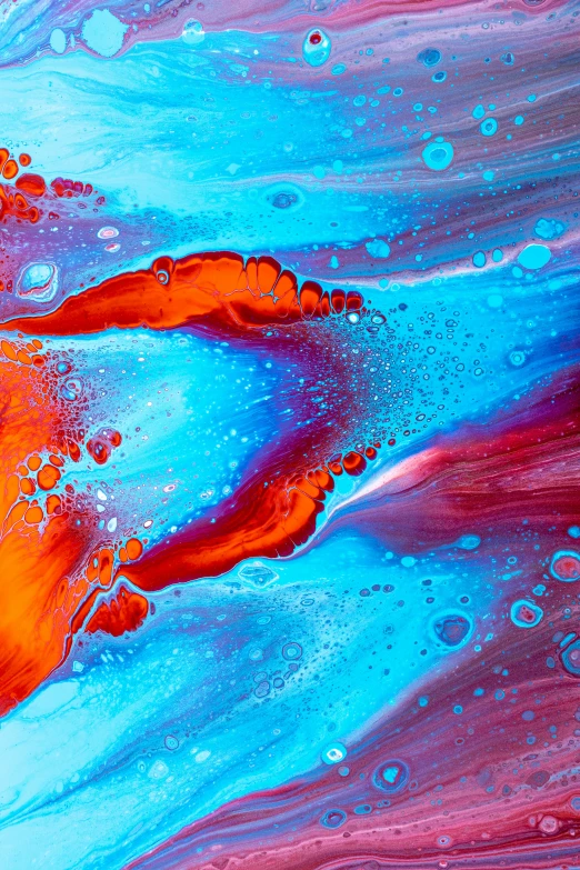 the colorful fluid painted on the wall has red and blue colors