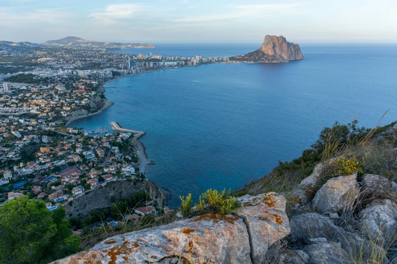 the view over the bay with the mountains and a city