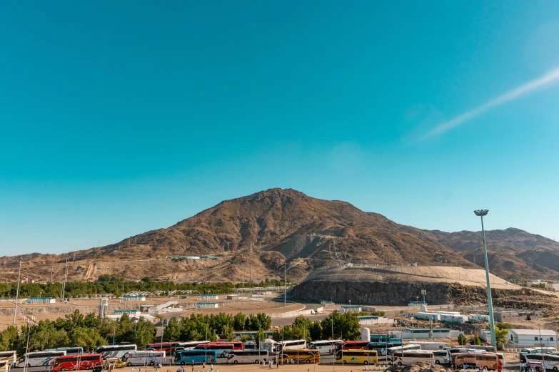 this is a lot of cars parked near the mountains