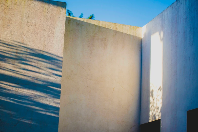 a concrete wall near the entrance to a building