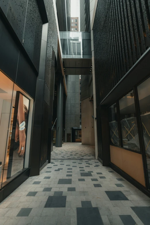 a hallway inside of a mall next to an entrance