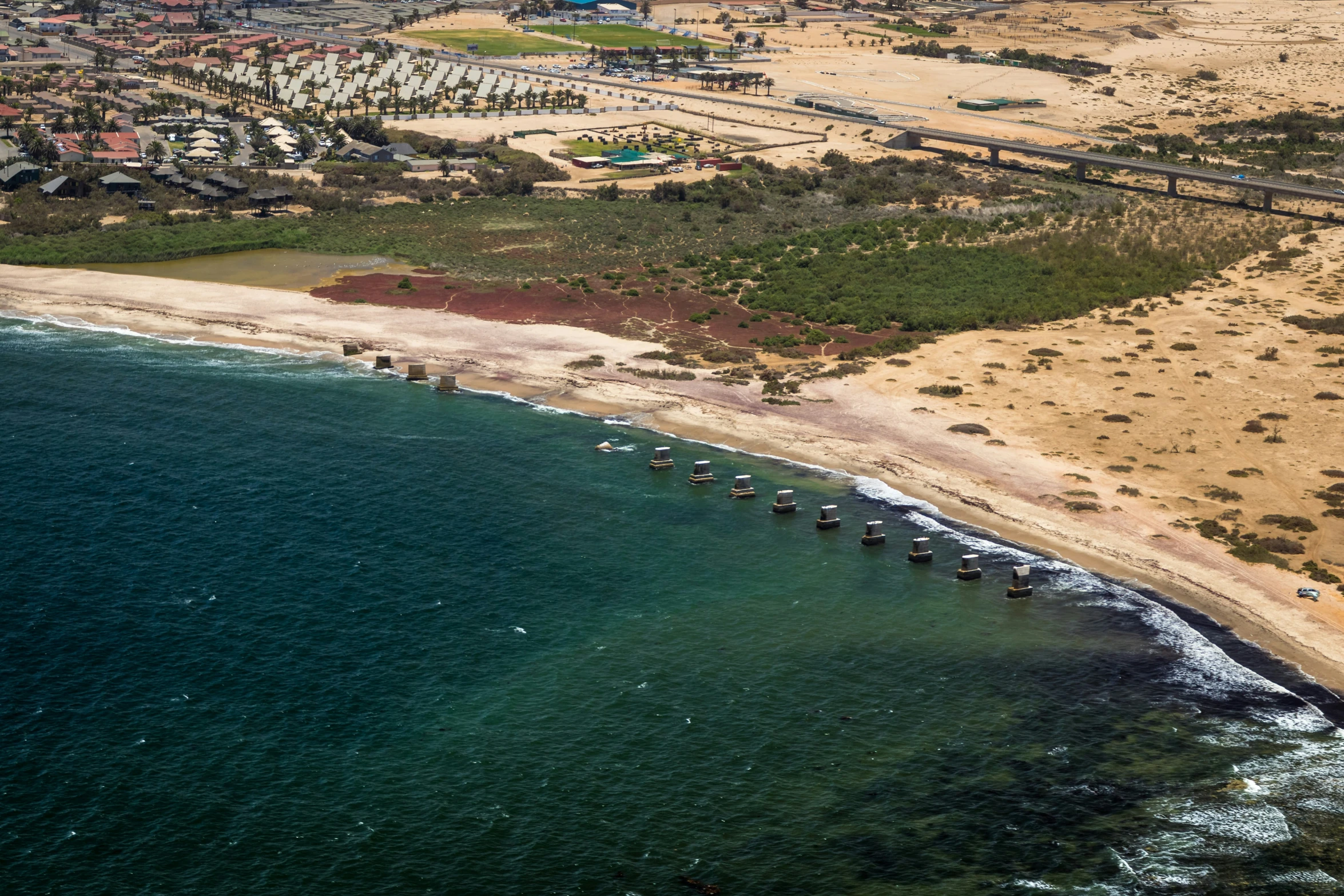 a very pretty view of the beach next to the ocean