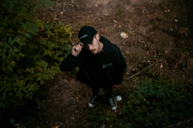 a man with a hat on top of a field