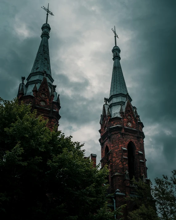 two clocks are visible at the top of a church steeple