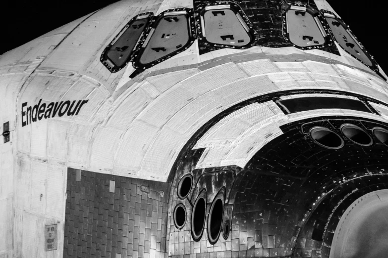 the side of the space shuttle showing all its cargo bay and door