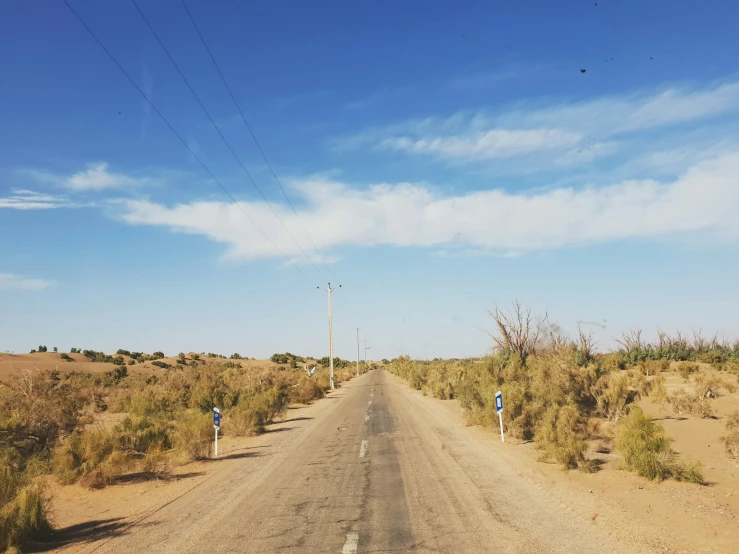 the road between two separate streets in the desert