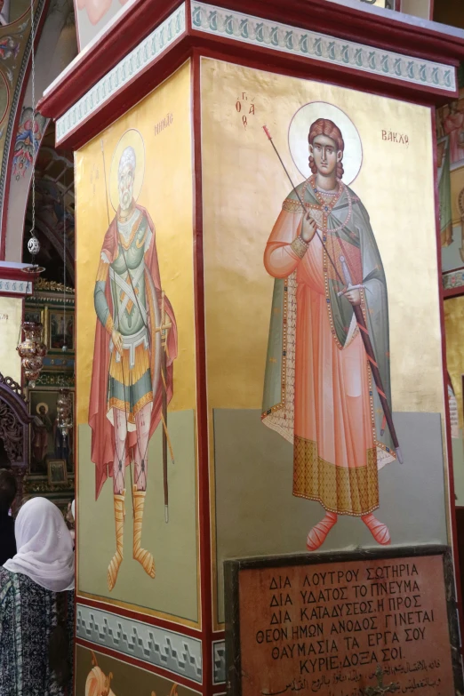 an ornately decorated alter depicting an old man and woman