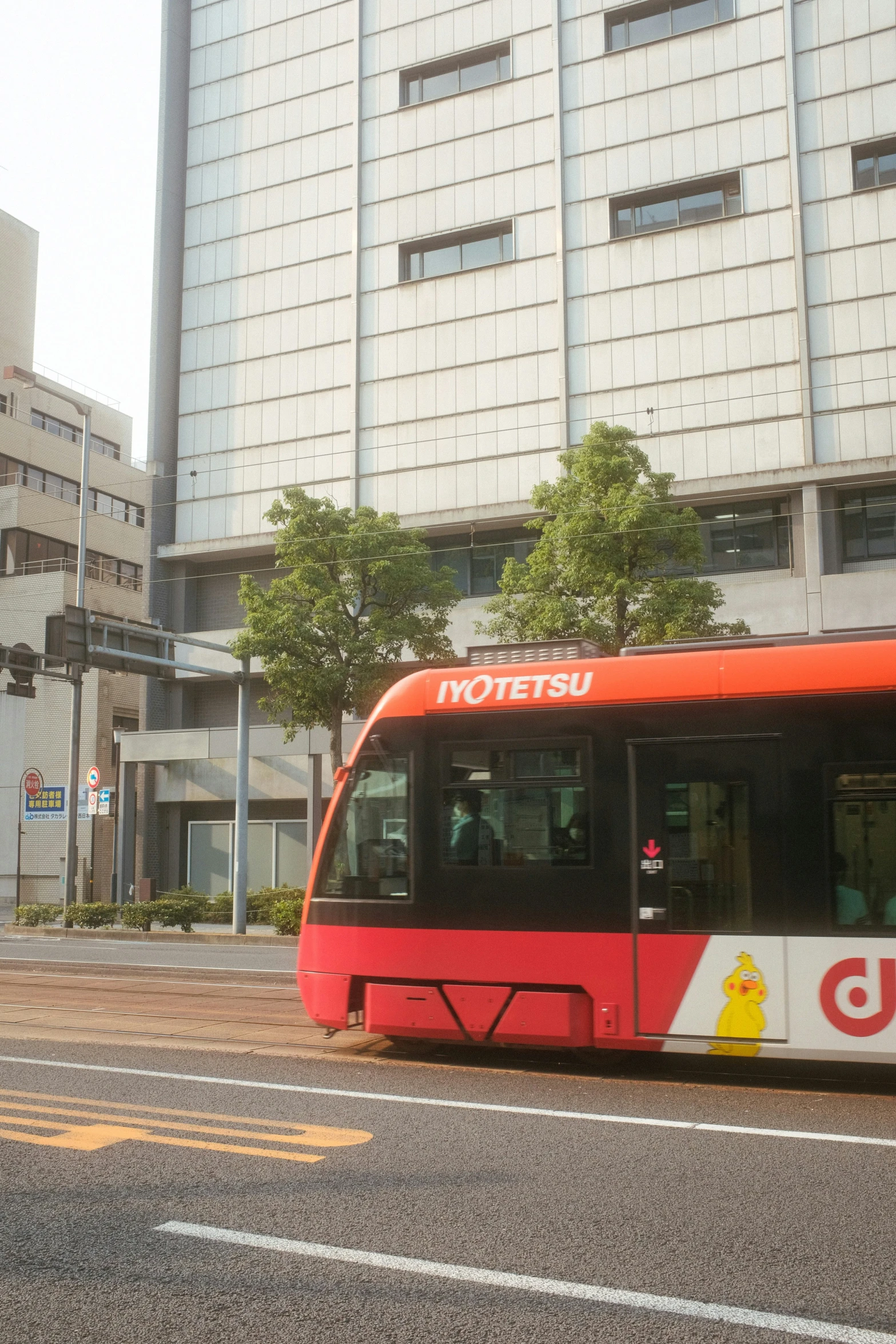 red and white metro bus riding down the street