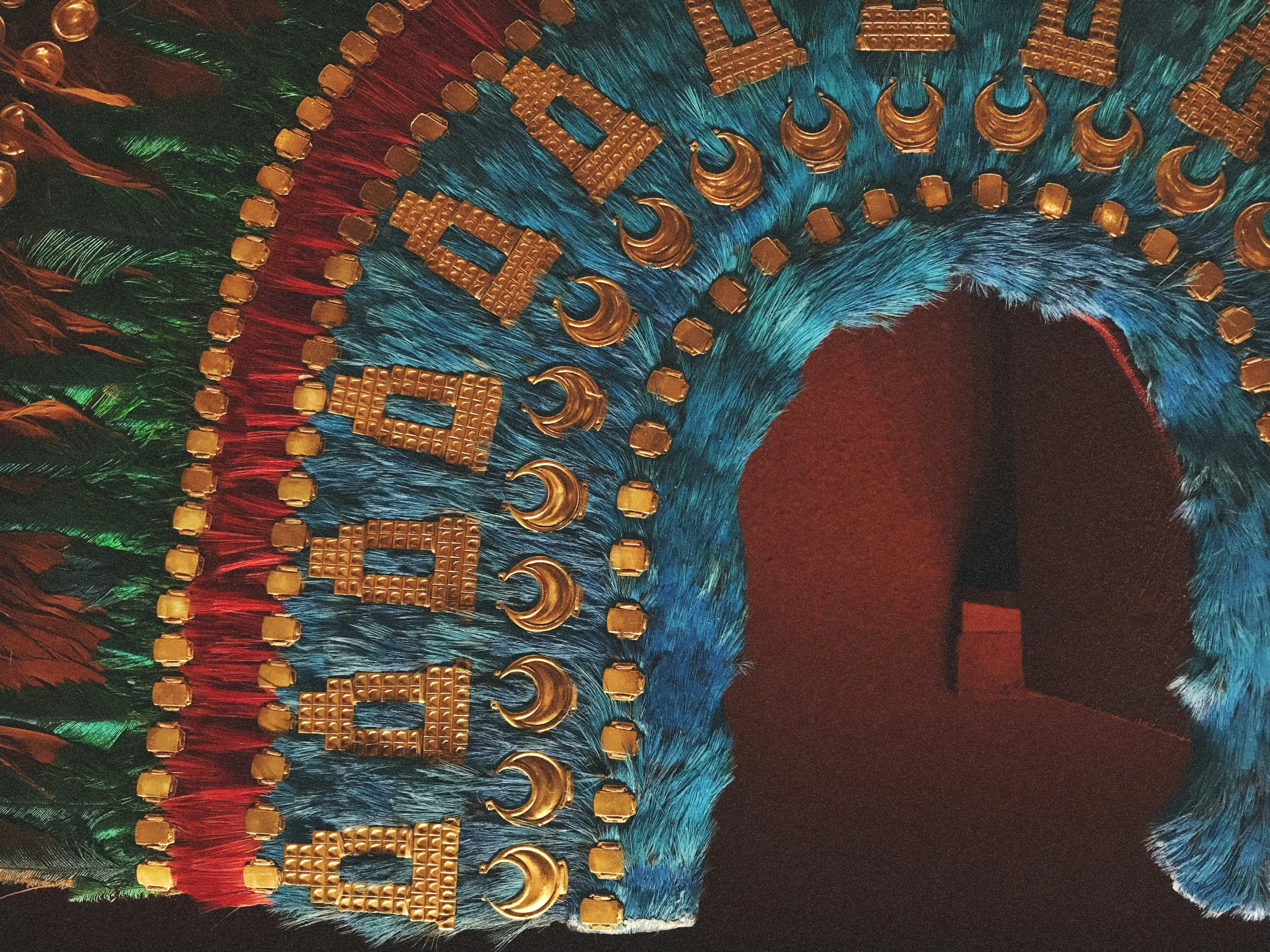 a large colorful decorated doorway with gold writing