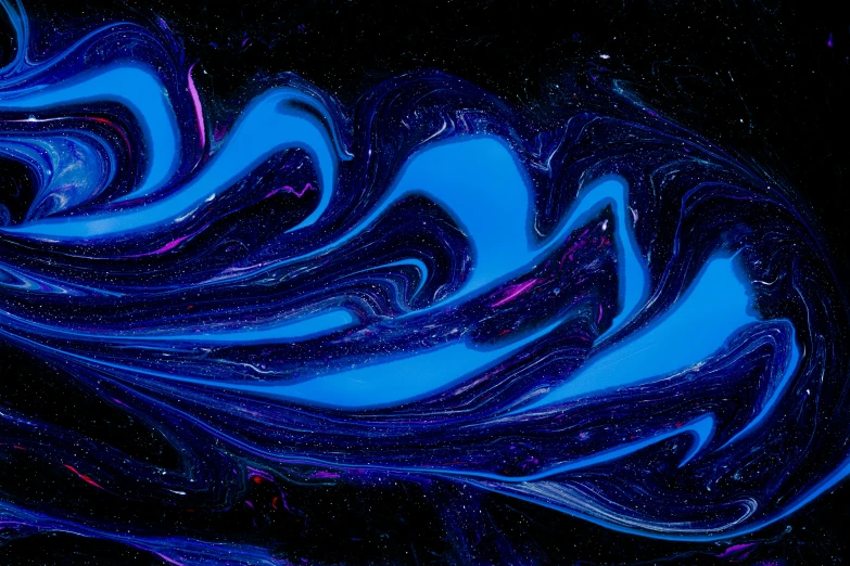 some blue swirls are shining on a black background