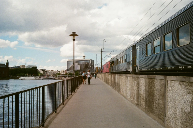 a passenger train that is pulling into the train station