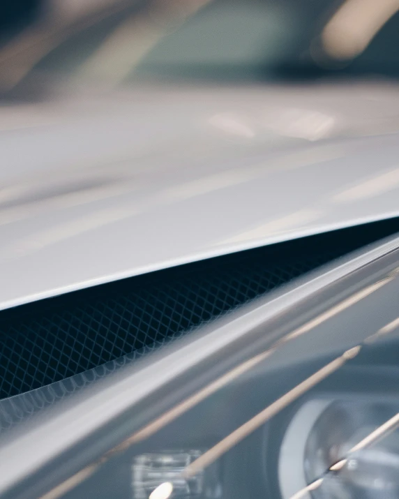 the corner of an automobile looking windshield