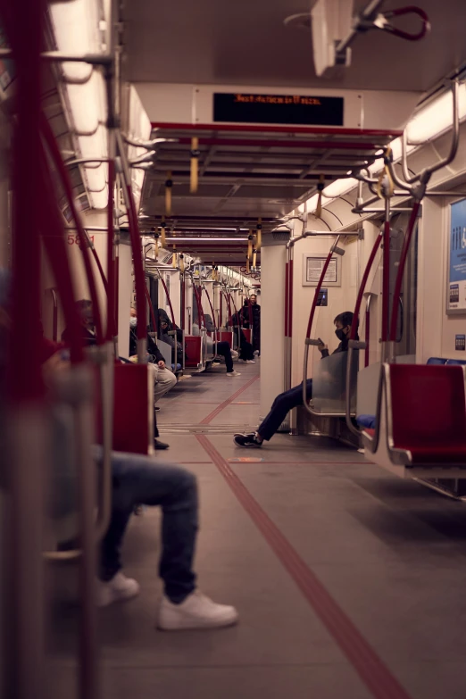 people riding on a bus with red line going through