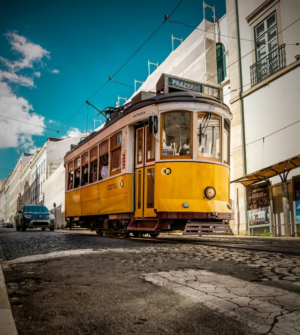 a street car is driving on some tracks