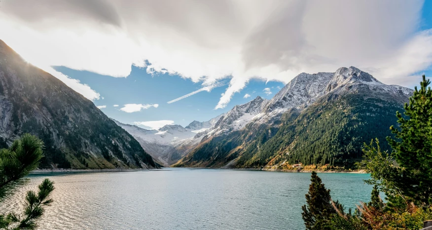 there is a mountain lake surrounded by trees