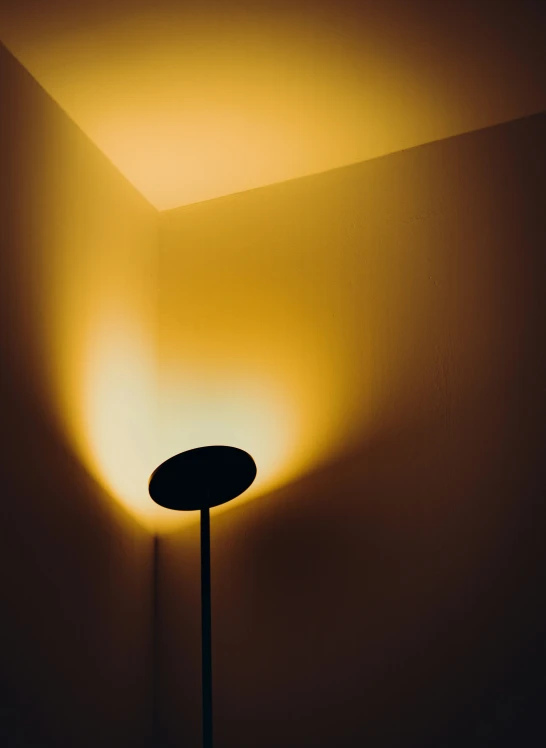 a lamp sits in a dim, dimly lit room