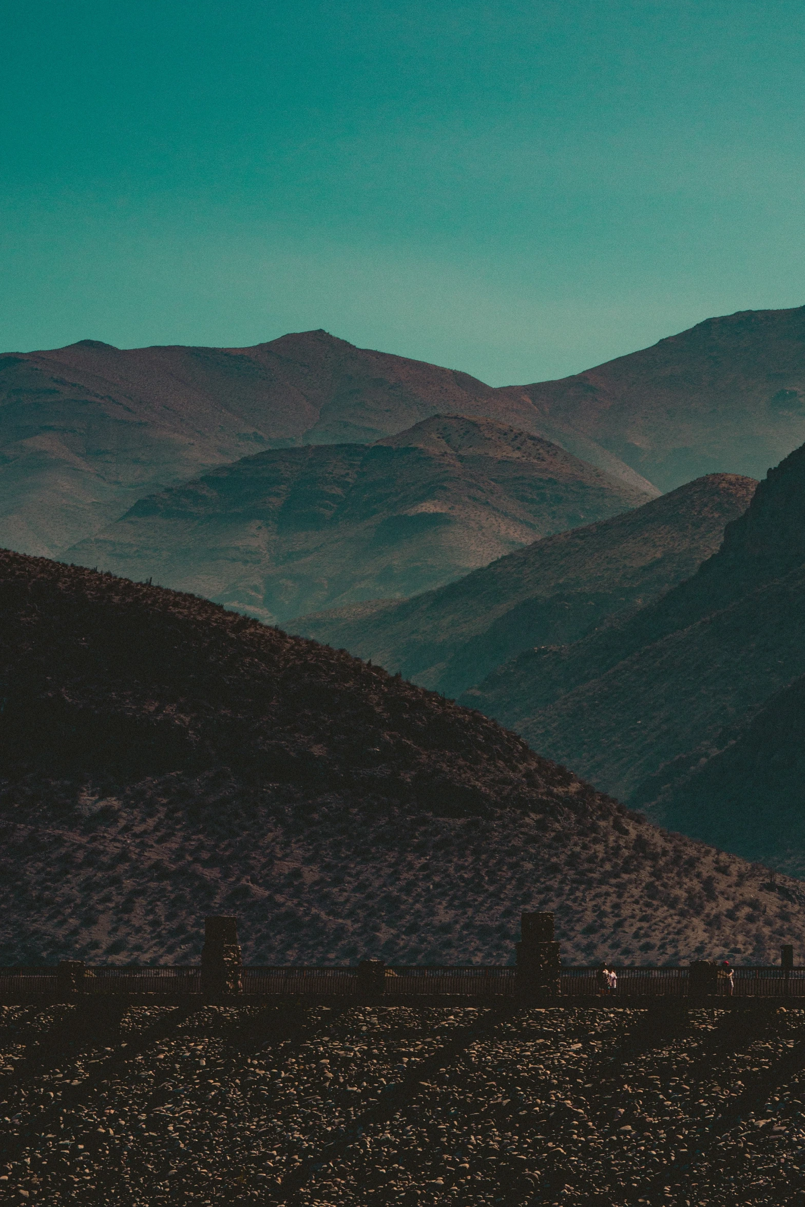 there are some trees and mountains on the hillside