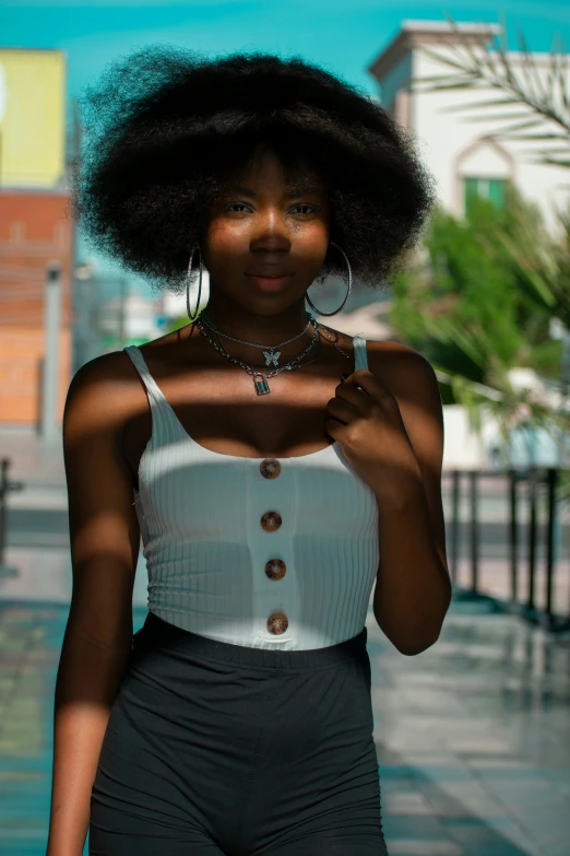 an african american woman is walking down the street