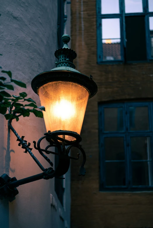 a light is hanging off of the side of a building