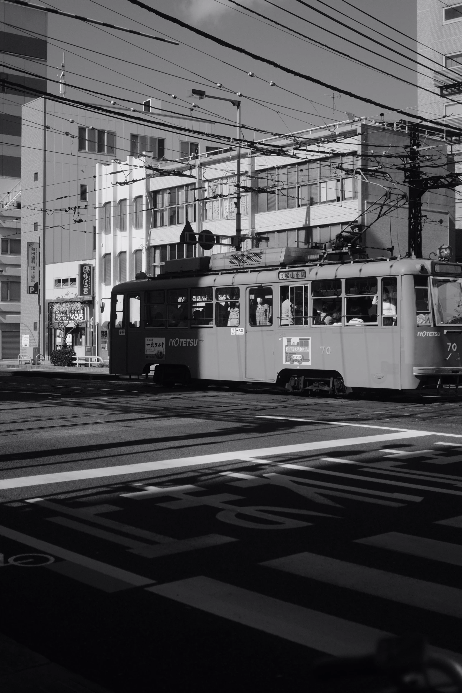 black and white po of a streetcar in an urban setting