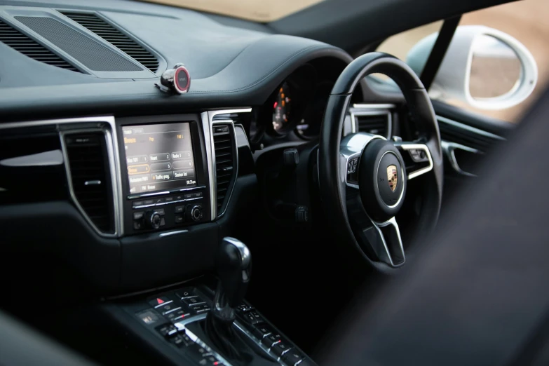 dashboard of vehicle including steering wheel and dashboard display