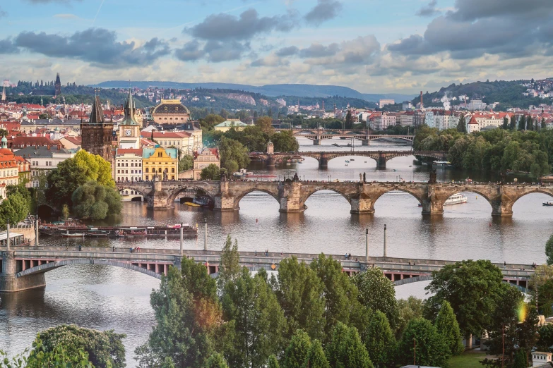 an old bridge and river in prague, france