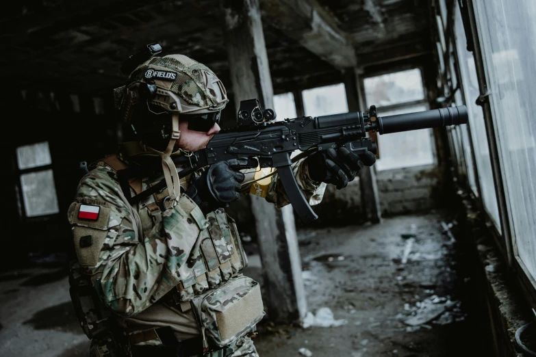 a man in a camouflage uniform is holding an ak47