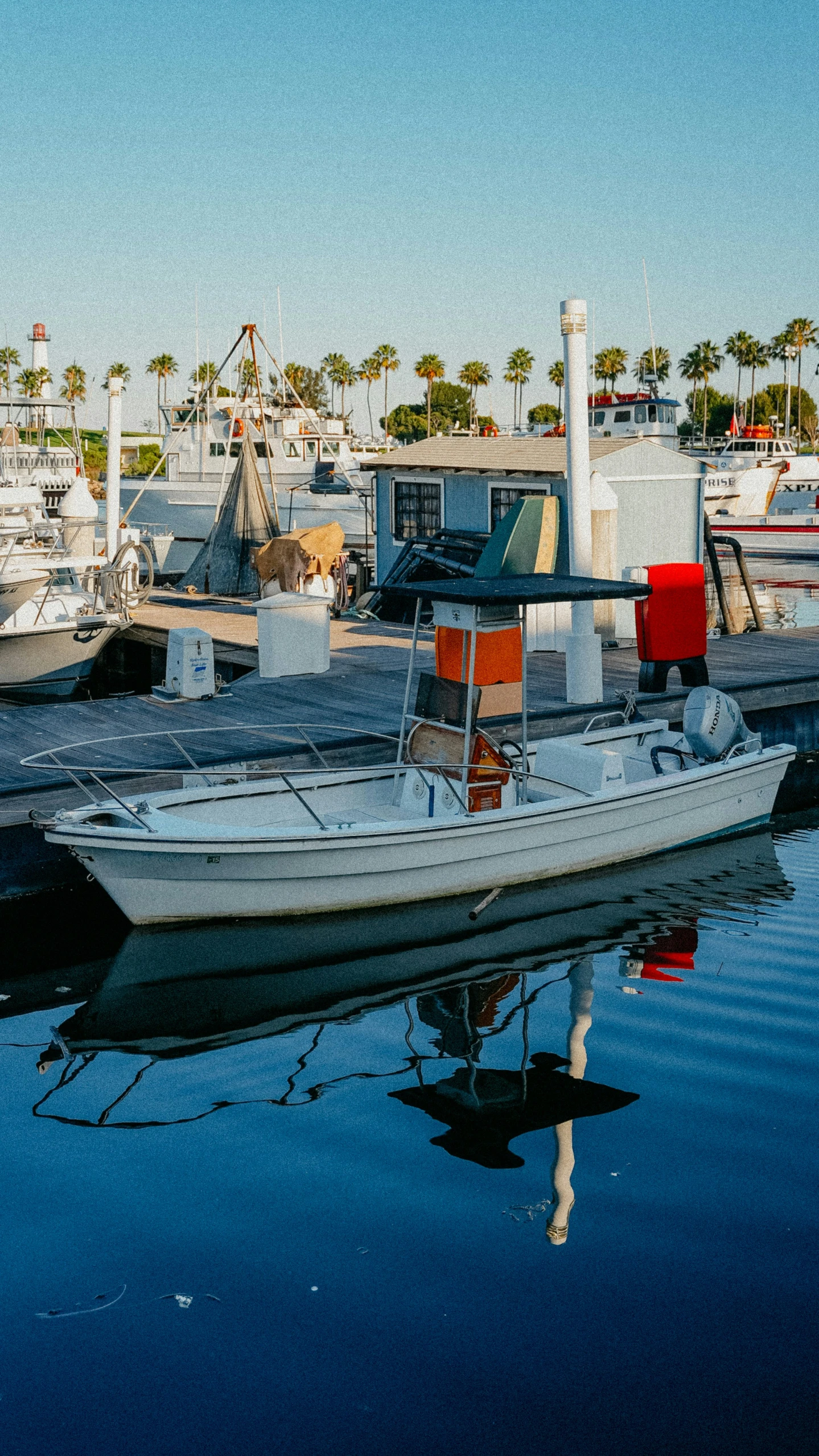 a boat sitting in the water with buildings in the background