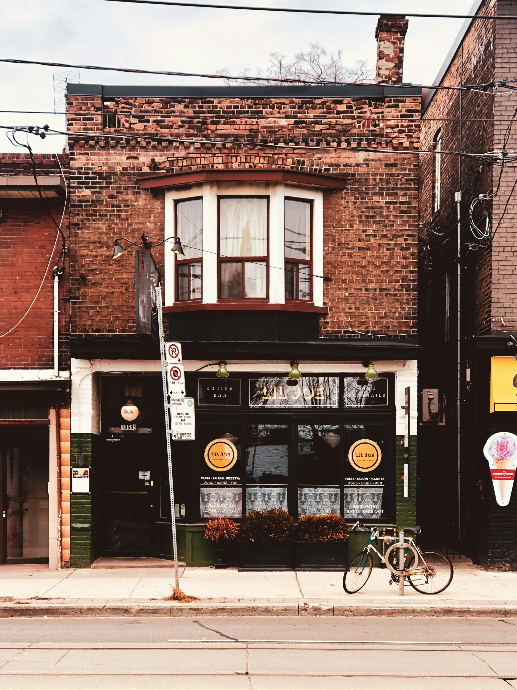 the bike is parked on the side of the building