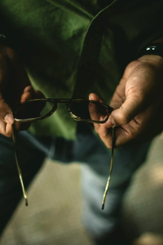 a man is holding some kind of pair of glasses