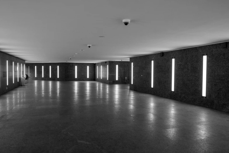a large dark room with some lights in it