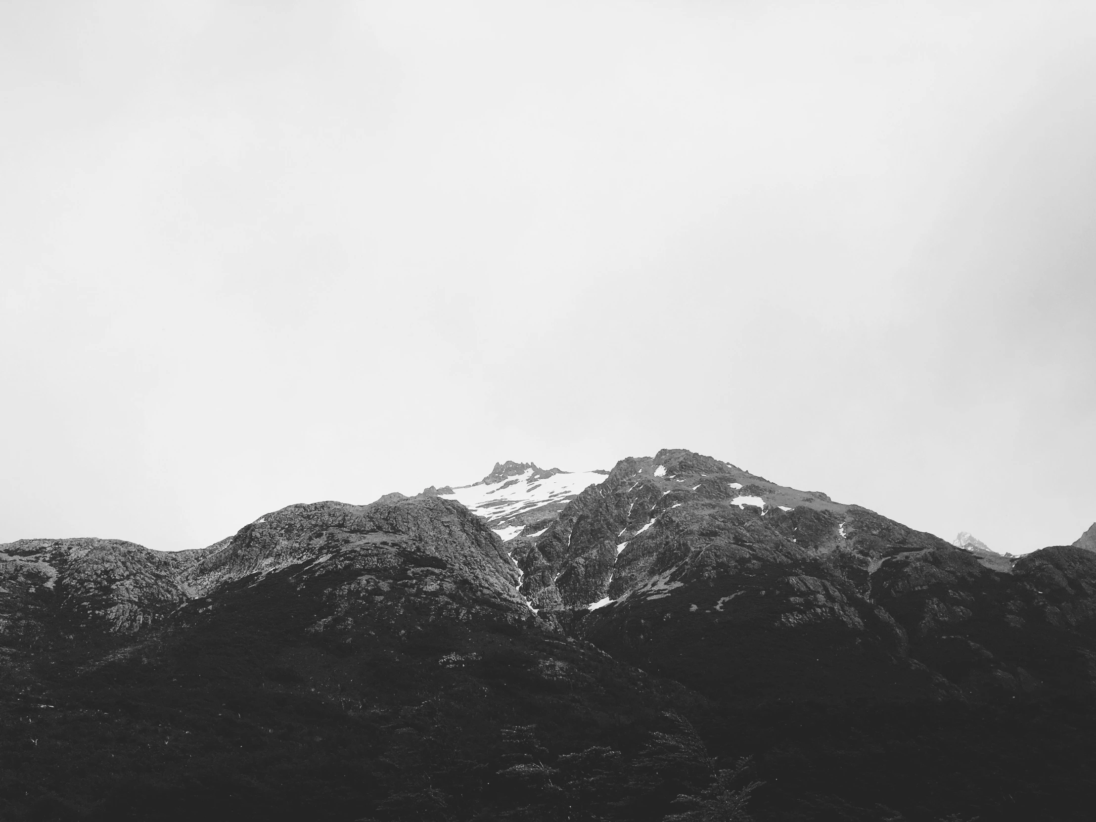 a group of mountains that has snow on them